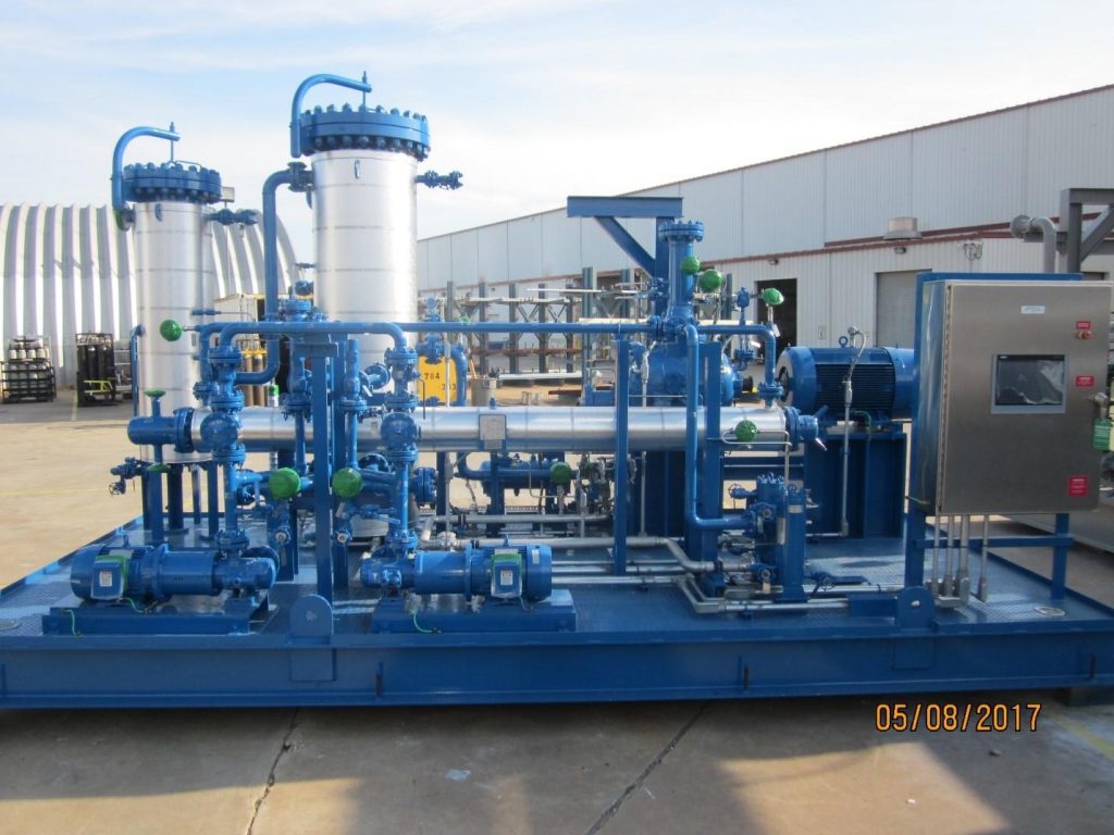 Industrial filtration system with blue machinery and piping setup outdoors. Dated May 8, 2017.